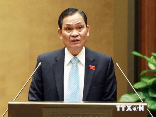 Bộ trưởng Bộ Nội vụ Nguyễn Thái Bình trình bày Tờ trình về dự án Luật tổ chức Chính phủ (sửa đổi) và Tờ trình về dự án Luật tổ chức chính quyền địa phương. (Ảnh: TTXVN)