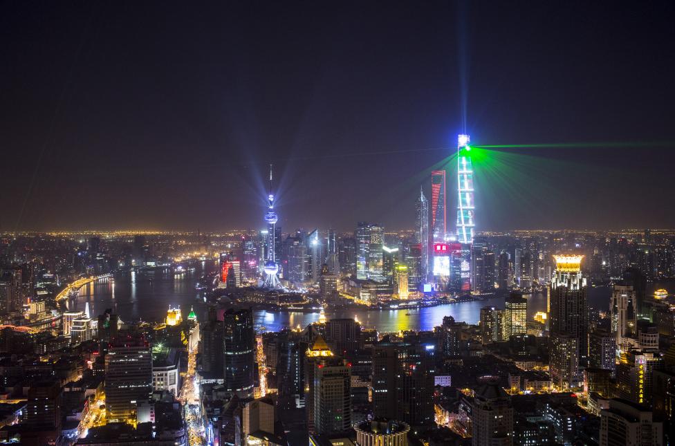 3 Light and laser illuminate the Lujiazui financial district of Pudong in Shanghai, China, during a light show as part of a New Year countdown celebrations on the Bund in Shanghai January 1, 2015. 