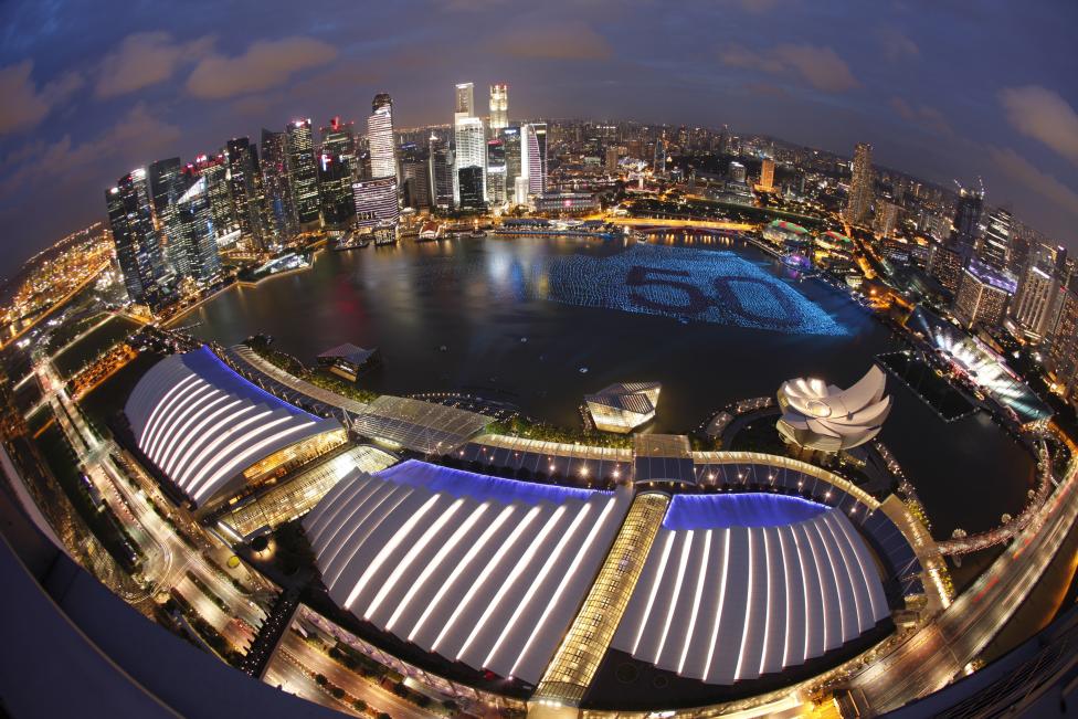 7 A floating installation of 25,000 wishing spheres line Marina Bay as the city's financial district is seen in the background, ahead of the New Year's Day countdown celebrations, in Singapore December 31, 2014. Throughout December, people penned their New Year's wishes on the spheres to be placed in the waters as part of the coming New Year Day celebrations. 