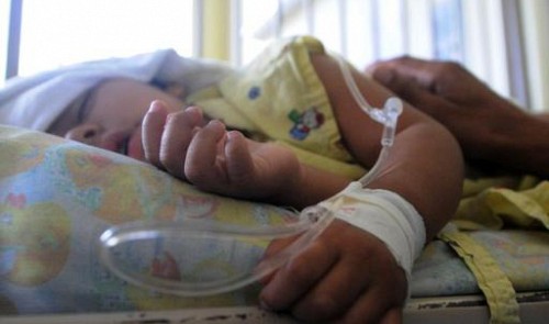 A boy affected by dengue fever rests at a hospital in Tegucigalpa, Honduras, on March 3, 2014.