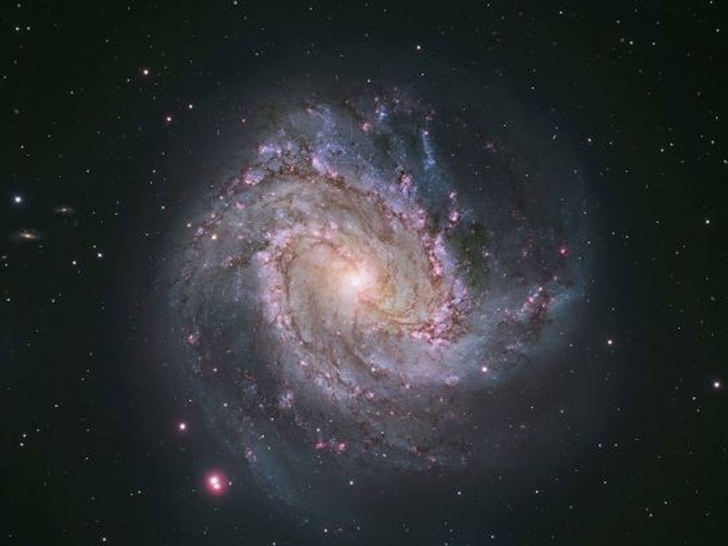 The barred spiral galaxy M83, also known as the Southern Pinwheel. The Hubble photograph captures thousands of star clusters, hundreds of thousands of individual stars, and 'ghosts' of dead stars called supernova remnants.