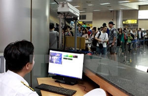 Body temperature of passengers at an airport is checked