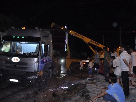 The site of the accident in Dong Nai Province, where a container trailer was thrown 20m away by a train.