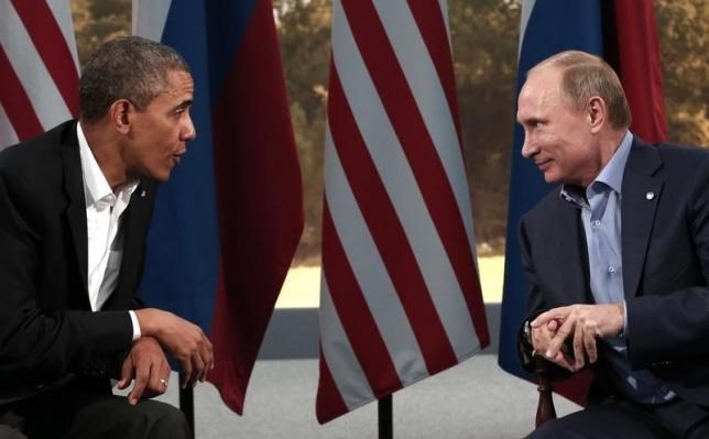 Tổng thống Vladimir Putin (phải) và người đồng cấp Mỹ Barack Obama trong một cuộc gặp hồi tháng 6/2013. (Nguồn: Reuters)