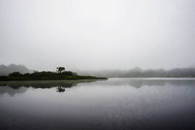  Misty morning view of Con Dau. 