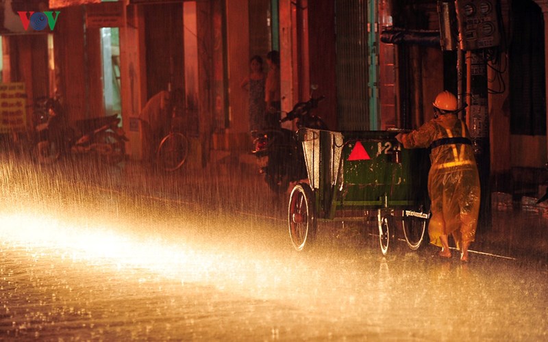  Sanitation workers in a rainy night 