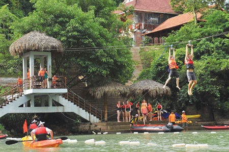 Foreign tourists enjoy activities in the central province of Quang Binh. The number of foreign tourists visiting Viet Nam has grown over the last three months, following a 13-month decline due to disease, unstable economies and fierce regional competition.