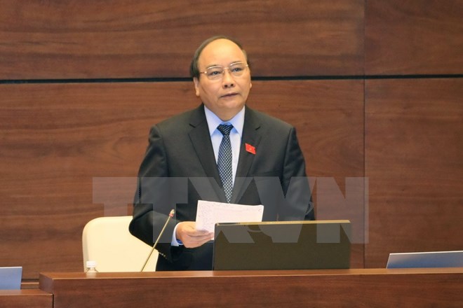 Phó Thủ tướng Chính phủ Nguyễn Xuân Phúc trả lời chất vấn. (Ảnh: Phương Hoa/TTXVN)