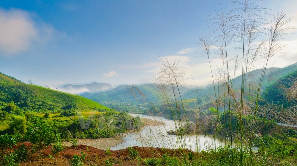 The picturesque river winds around the mountains and hills in the district.