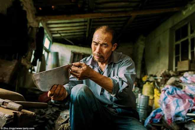 New Talent: Street Culture - Winner - Photographer Zhu Jingyi from China took this picture of a blacksmith in Jiangsu, China