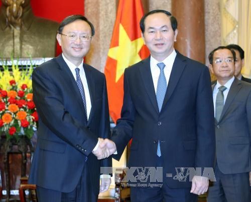 President Tran Dai Quang (R) receives Chinese State Councilor Yang Jiechi.