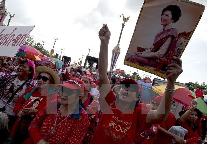 Lực lượng Áo đỏ ủng hộ chính phủ tuần hành tại Bangkok năm 2014. (Nguồn: AFP/TTXVN)