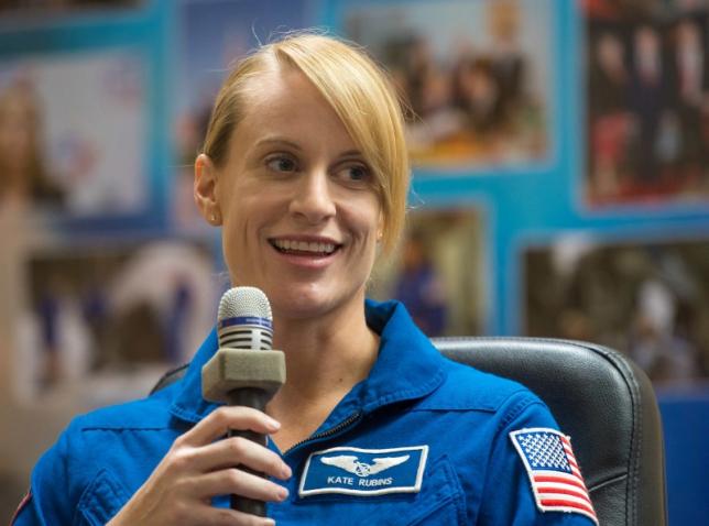 NASA astronaut Kate Rubins seen in quarantine behind glass during a crew press conference at the Cosmonaut Hotel in Baikonur, Kazakhstan, July 6, 2016.