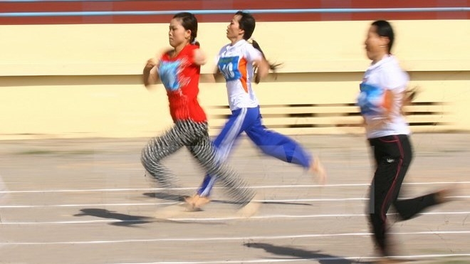 Disable athletes compete in the track and field event. (Source: Nhan Dan)