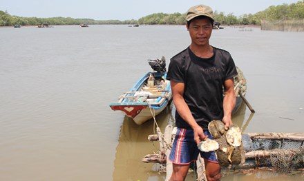 Duong Van Sang has recently tried raising clams on the Thi Vai River but they they all died