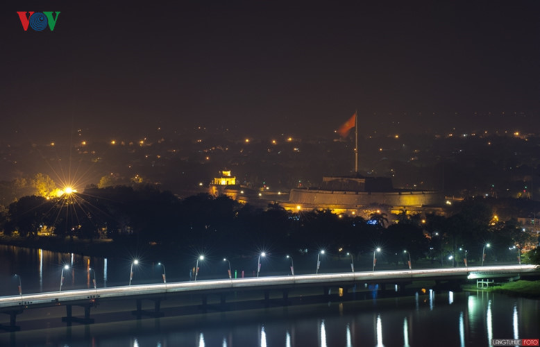 Phu Xuan Bridge shimmering at night.