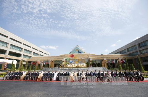 Participants pose for photo at the second Asia Cooperation Dialogue Summit