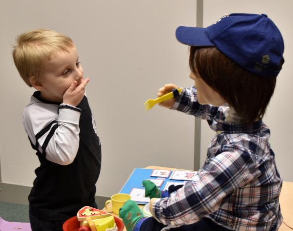  Harrison, 5, who is autistic, plays with Kaspar, a child-sized humanoid robot developed at the University of Hertfordshire to interact and help improve the lives of children with autism, in Stevenage, Britain January 30, 2017. 