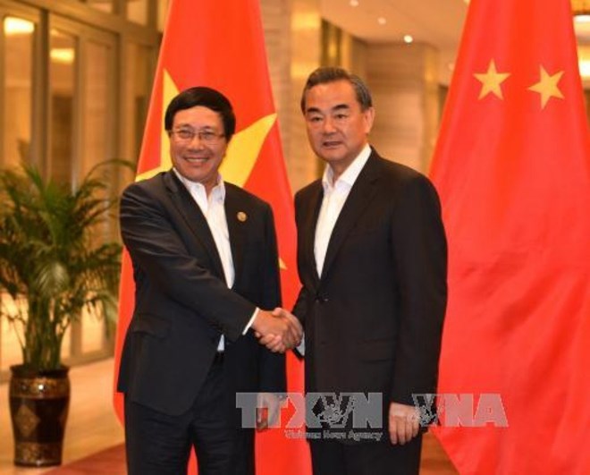 Deputy Prime Minister and Foreign Minister Pham Binh Minh and Chinese Foreign Minister Wang Yi 