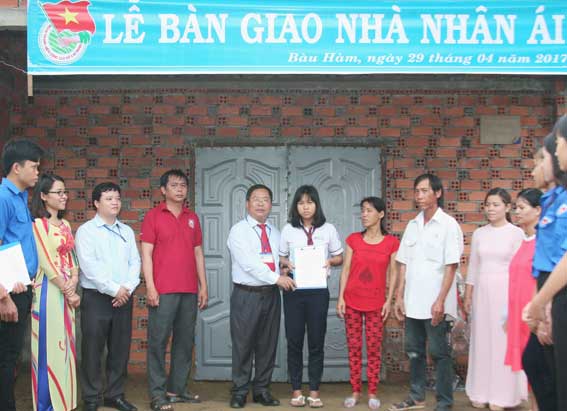 Presenting charity house to poor student
