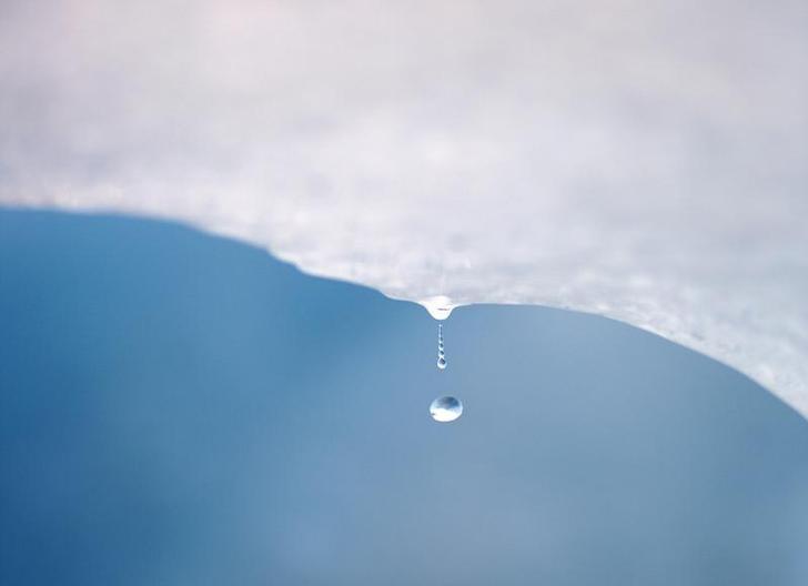 A drop of water falls from a melting piece of ice on Argentina's Perito Moreno glacier near the city of El Calafate, in the Patagonian province of Santa Cruz, December 16, 2009