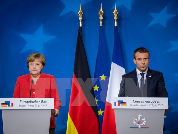 Tổng thống Pháp Emmanuel Macron và Thủ tướng Đức Angela Merkel. (Nguồn: AFP/ TTXVN)