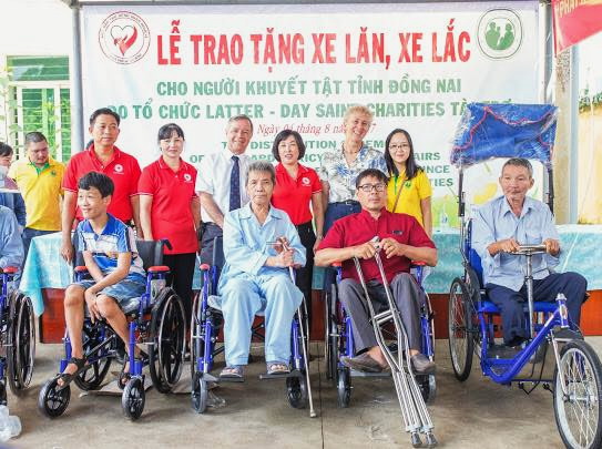 Presenting 114 wheelchairs to disabled people