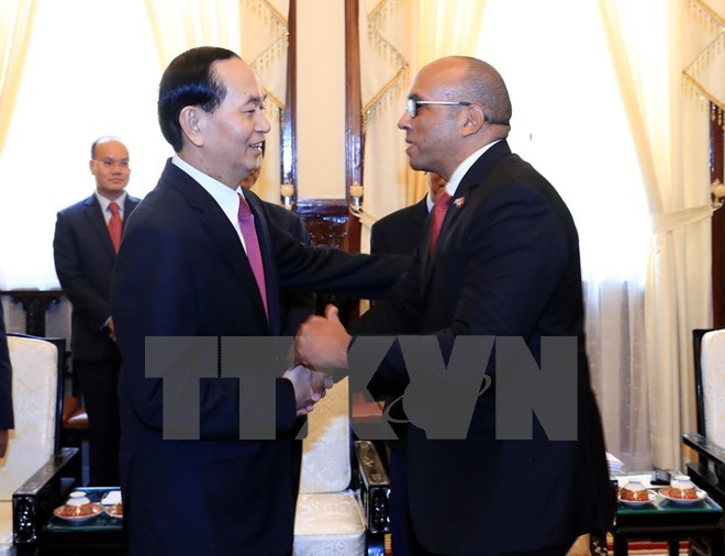 President Tran Dai Quang (L) receives outgoing Ambassador Herminio Lopez Diaz on August 28