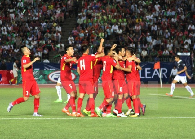 Vietnamese players celebrate their win against Cambodia on September 5 (Photo: VNA)