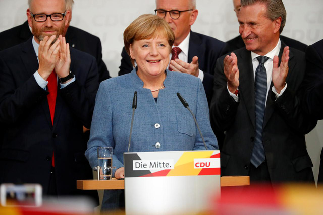 Cảm xúc của bà Merkel và các thành viên CDU sau khi biết kết quả khảo sát phiếu bầu - Nguồn REUTERS