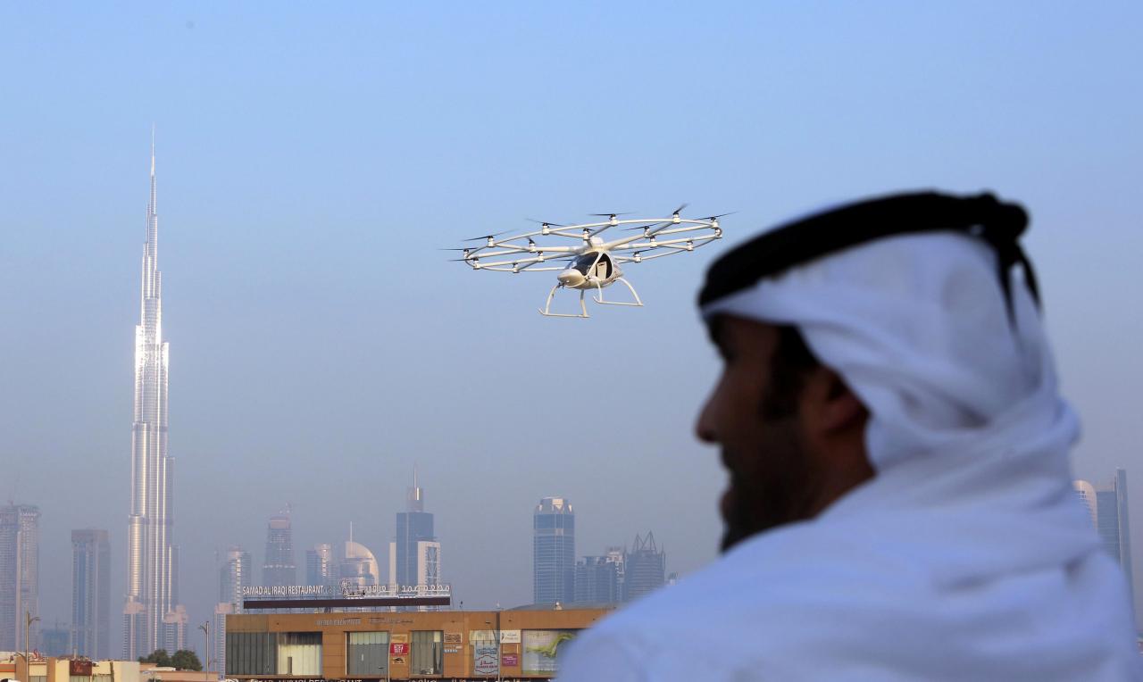 Noah Browning  3 Min Read  A man looks on as the flying taxi is seen in Dubai, United Arab Emirates September 25, 2017. 