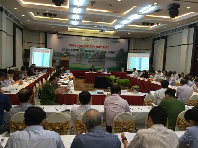 Attendees at the 11th meeting of the ​Dong Nai River’s Environmental Protection Committee discuss solutions for environmental protection in the Dong Nai River basin at a meeting on Friday  in HCM City (Photo: VNA)