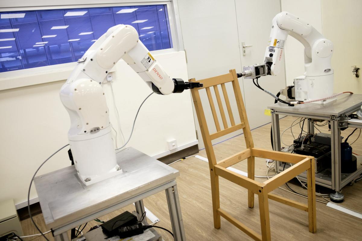 Robots assemble an Ikea chair at Nanyang Technological University (NTU) in Singapore April 17, 2018. Picture taken April 17, 2018. 