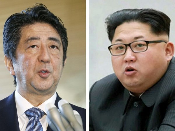 Thủ tướng Nhật Bản Shinzo Abe (trái) và nhà lãnh đạo Triều Tiên Kim Jong-un (phải). (Nguồn: Kyodo/TTXVN)