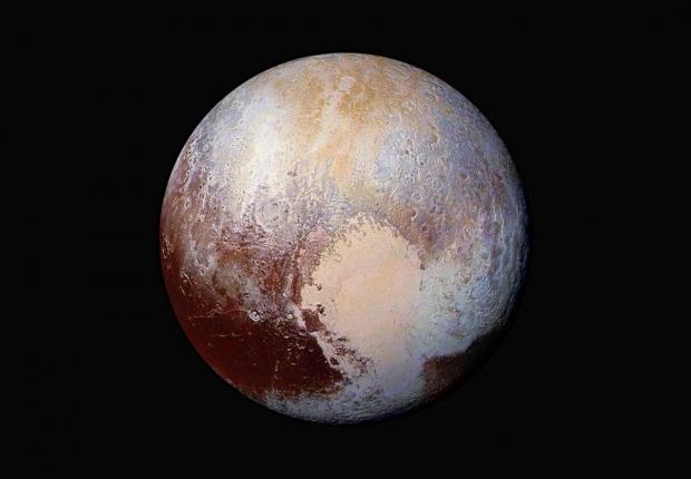 The planet Pluto is pictured in a handout image made up of four images from New Horizons' Long Range Reconnaissance Imager (LORRI) taken in July 2015 combined with color data from the Ralph instrument to create this enhanced color global view.