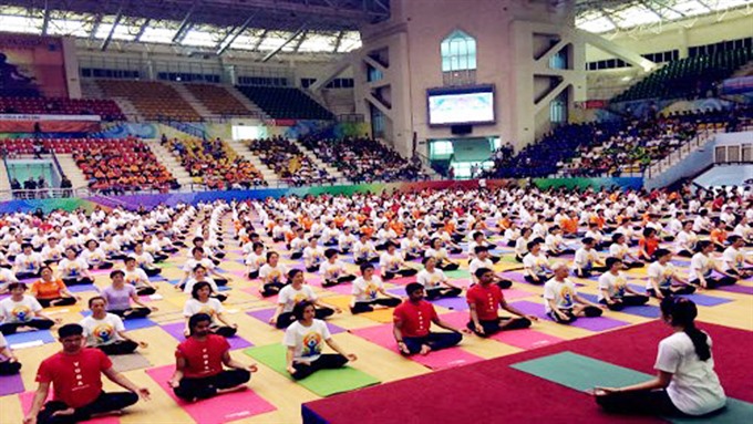 Some 1,200 Hanoian people will perform yoga on June 16 to start a series of events celebrating the Yoga Day in 11 provinces and cities throughout the country. — File Photo  Read more at http://vietnamnews.vn/life-style/449655/viet-nam-to-observe-international-day-of-yoga.html#mefJGwXBSQRqbRhG.99