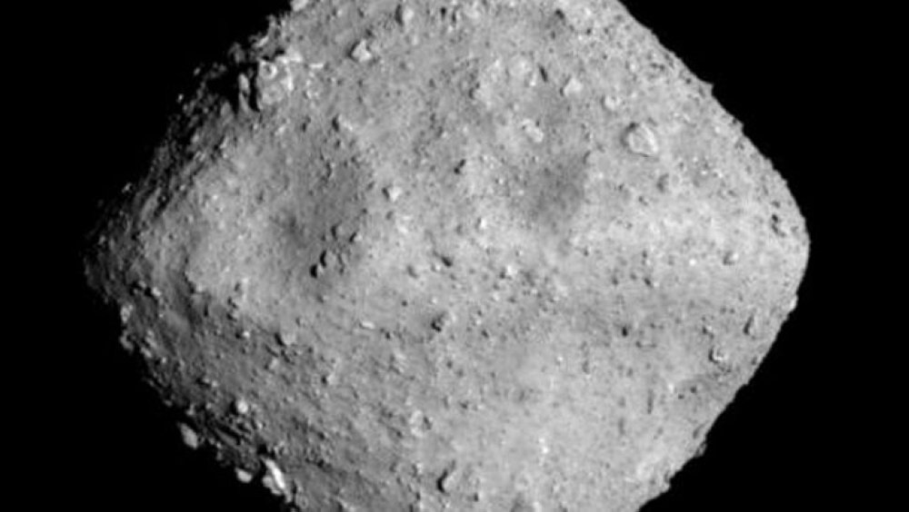 Asteroid Ryugu is photographed by the ONC-T which is equipped on Hayabusa 2 probe after a journey of around 3.2 billion km since launch, in outer space 280 million km from the Earth, on June 24, 2018 at around 00:01 JST, in this handout photo released by Japan Aerospace Exploration Agency (JAXA). 
