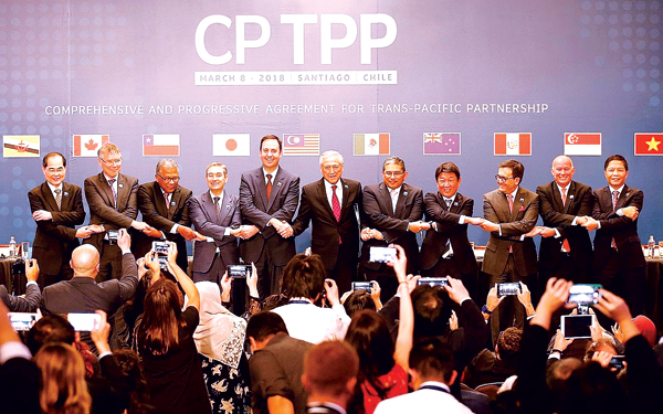 CPTPP chính thức được ký kết hồi tháng 3-2018 với 11 thành viên. Ảnh: Reuters