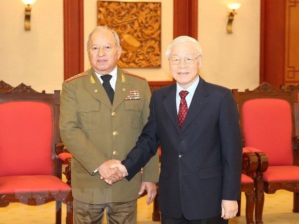 General Secretary of the Communist Party of Vietnam Central Committee and President Nguyen Phu Trong (R) and Minister of the Revolutionary Armed Forces of Cuba Leopoldo Cintra Frias