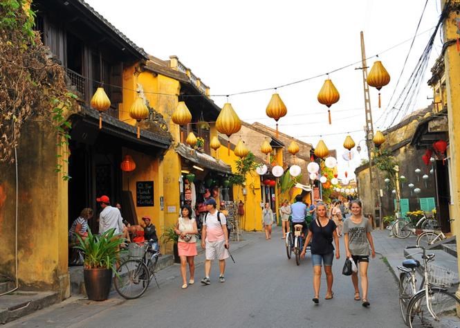 Domestic and foreign tourists visit Hoi An Ancient Town, a World Cultural Heritage Site in the central province of Quang Nam 