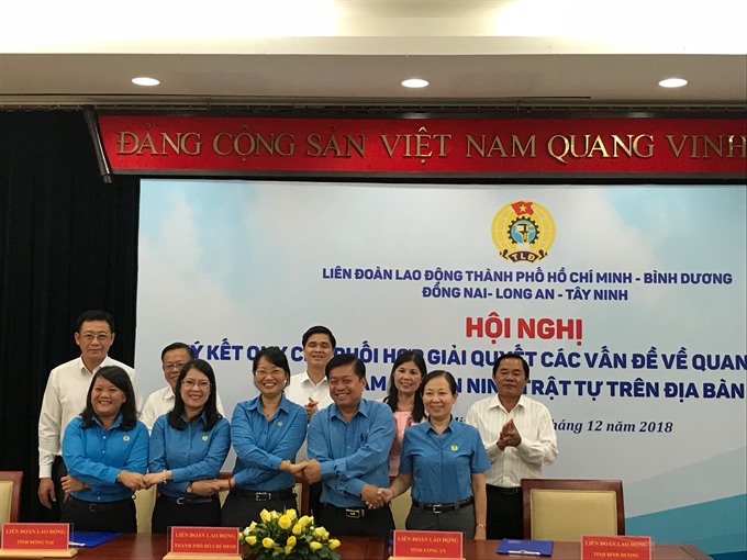 Labour federations in HCM City, neighbouring provinces ink deal to co-ordinate actions