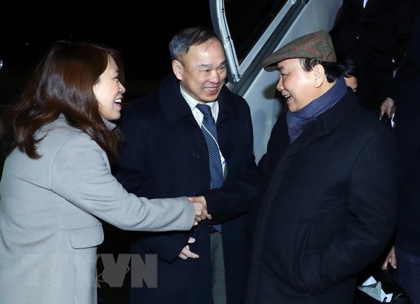 Prime Minister Nguyen Xuan Phuc (R) welcomed at Zurich International Airport.