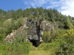 The entrance to Denisova Cave, which contains evidence of previous habitation by extinct human species, in the Anui River valley in the Altai mountains of Siberia, Russia, is shown in this image released on Jan. 30, 2019.