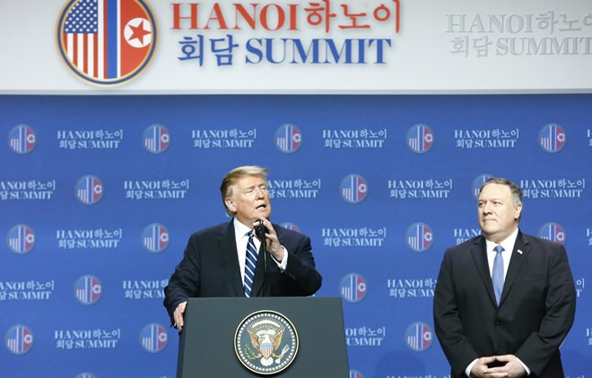 US President Donald Trump (L) at a press conference following his meeting with DPRK leader Kim Jong-un in Hanoi 