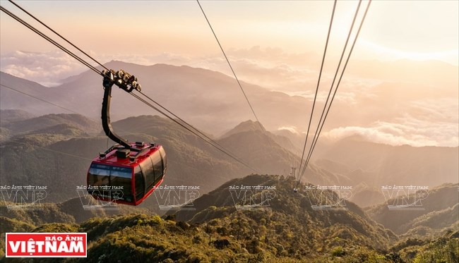 The cable car takes visitors through a green valley of natural forests, floating white clouds and terraced rice fields