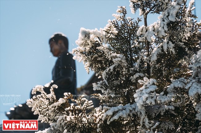 The peak of Fansipan is covered with snow during winter