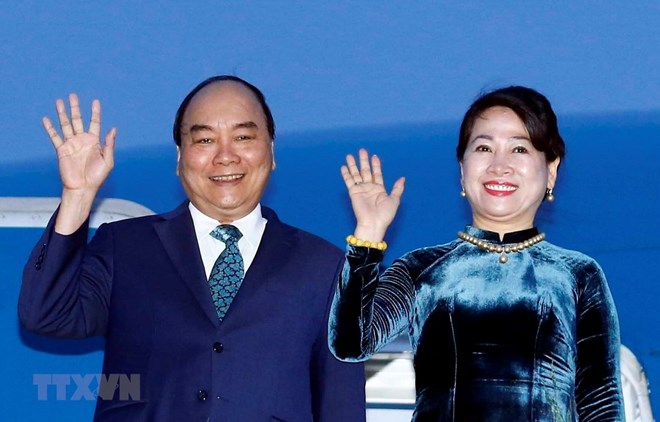 Prime Minister Nguyen Xuan Phuc (L) and his wife.