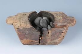 A wooden brazier and burnt stones from an archaeological site in western China that provided evidence for the burning of cannabis at a cemetery locale roughly 2,500 years ago, is shown in this image from the Pamir Mountains in Xinjiang region, released from Beijing, China, on June 12, 2019. 