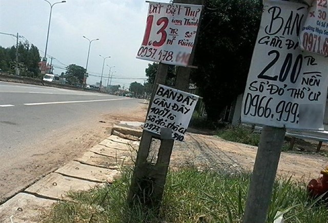 Signs indicate land for sale in Long Thanh district in Dong Nai province, site of the proposed new airport. 