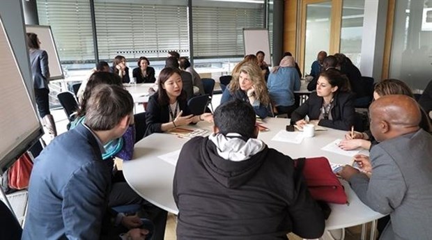 Nguyen Thi Anh Duong (third, left) discusses with her foreign fellows at an international seminar on sustainable development in Bonn, Germany, 2018. 